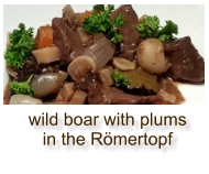 wild boar with plums in the Römertopf